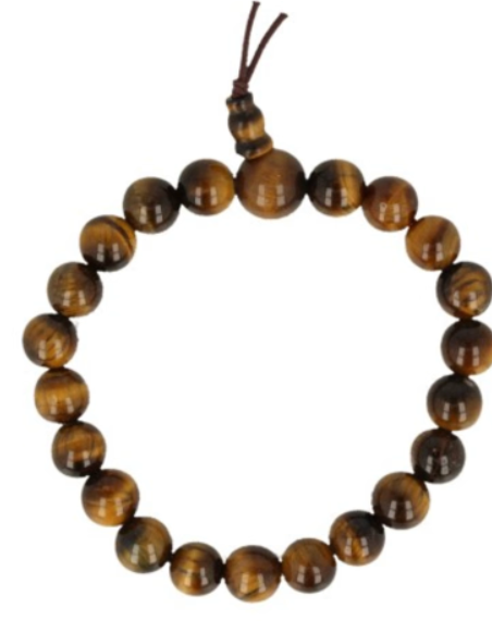 Armband van tijgeroogsteen met kwastje op een houten oppervlak.