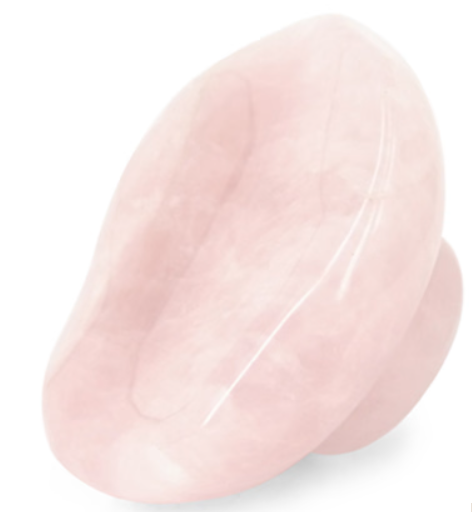 Roze rozenkwarts massage-instrument in de vorm van een paddenstoel.