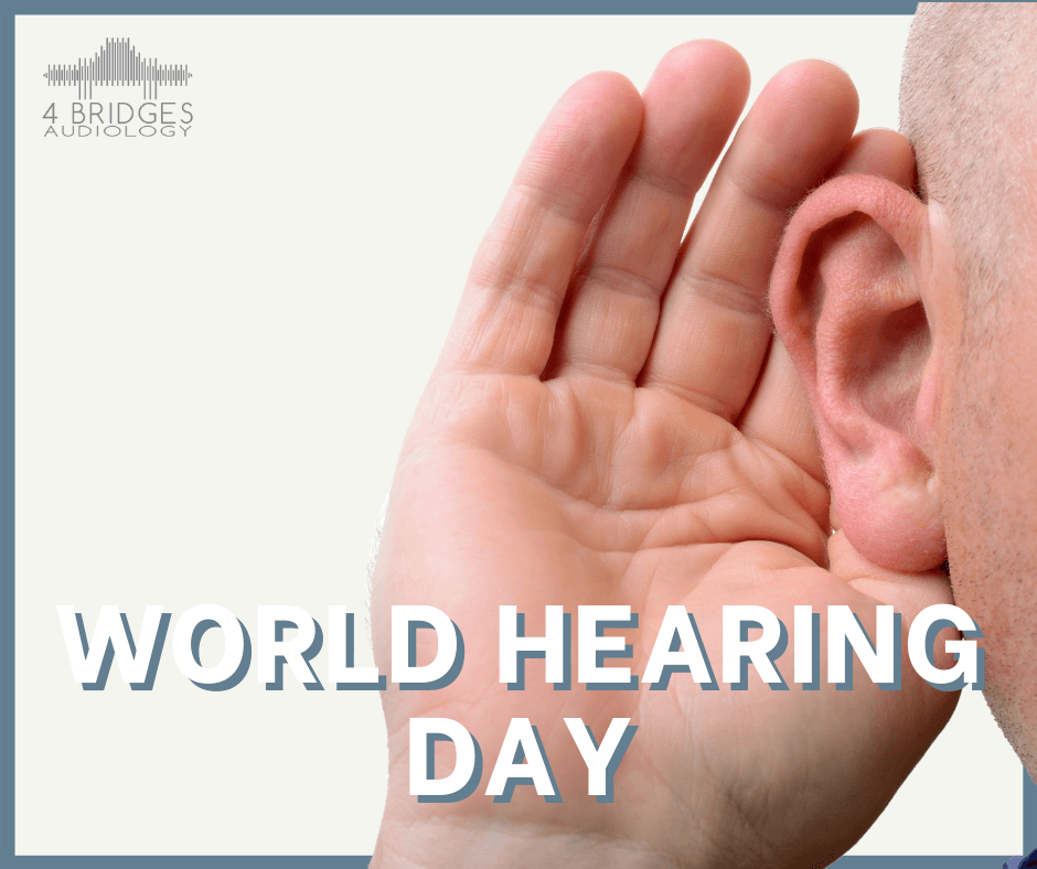 A man 's hand is covering his ear to celebrate world hearing day
