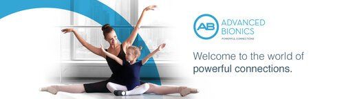 A couple of ballerinas are doing splits in front of a window.