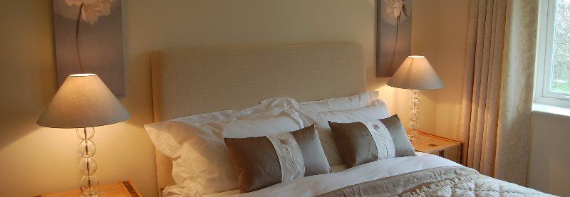 headboard and bedside lamps
