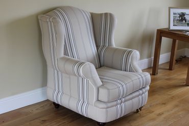 striped fabric wing back armchair