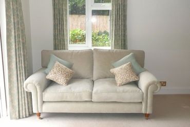 two seater sofa in grey and blue fabric