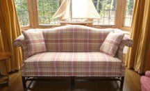 sofa upholstered in muted pink tartan