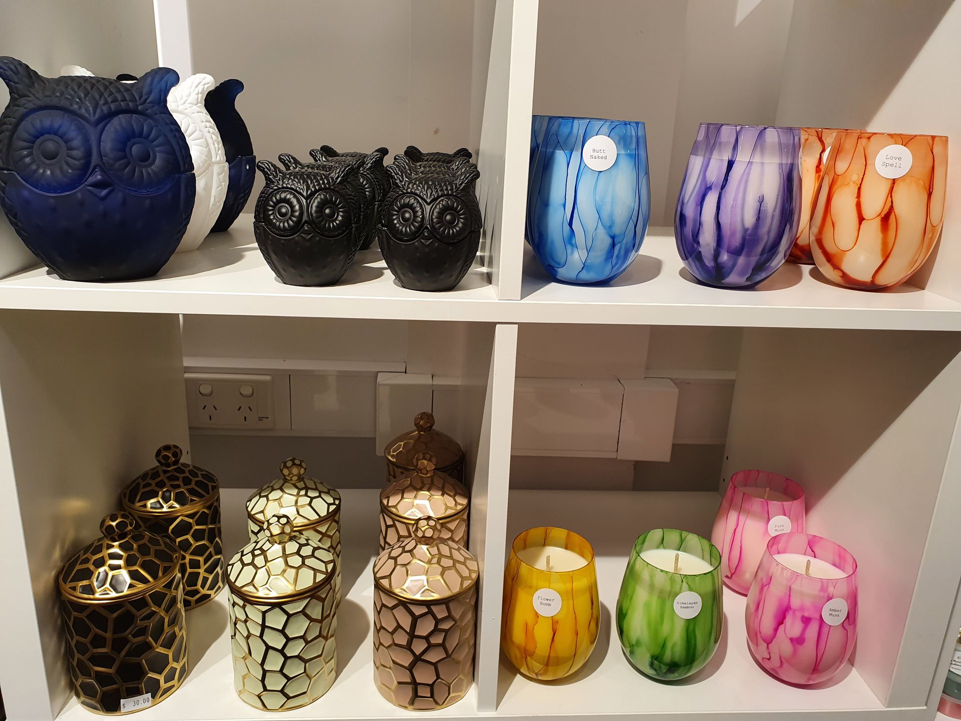 A Shelf Filled with Lots of Different Colored Candles — Eagle Rock Candles in Wodonga, VIC