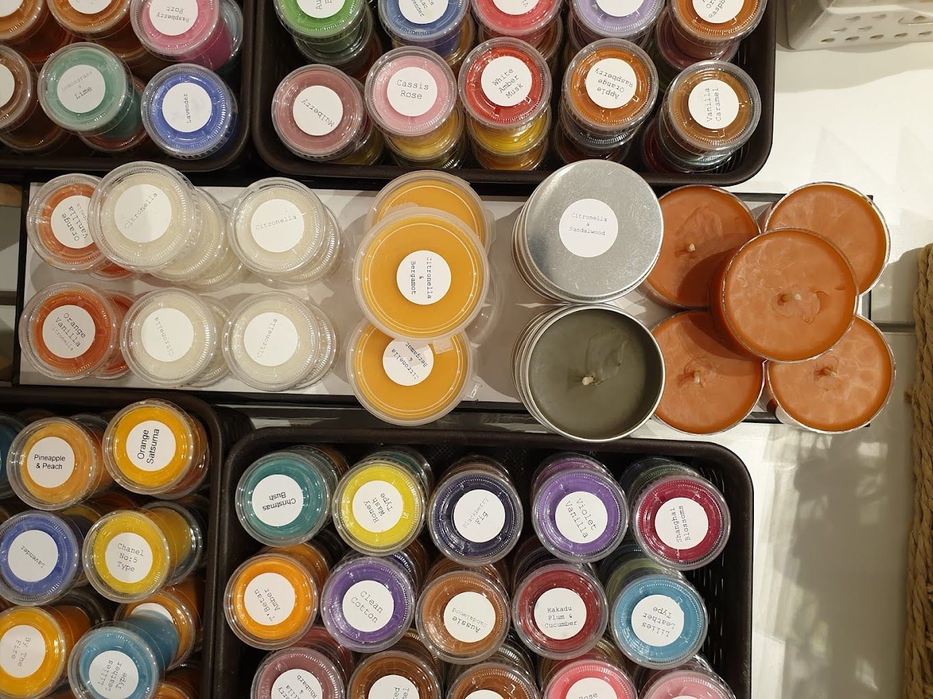 A Bunch of Different Colored Candles Are Sitting on A Table — Eagle Rock Candles in Wodonga, VIC