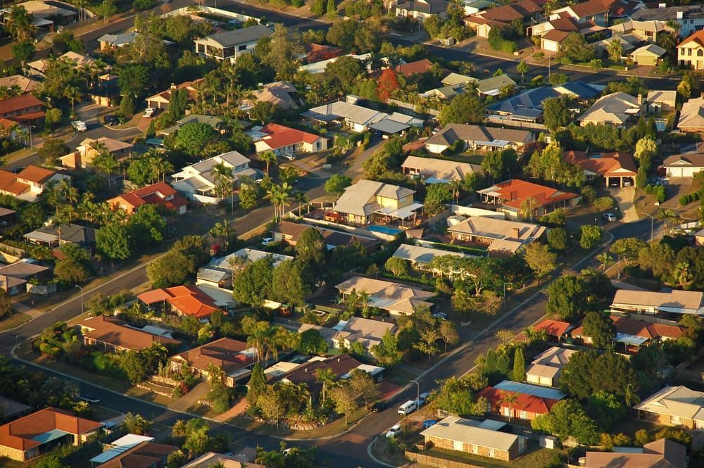 Aerial View of a Suburban Neighborhood With Houses — Glen Tier Bobcat & Truck Hire In Woree, QLD