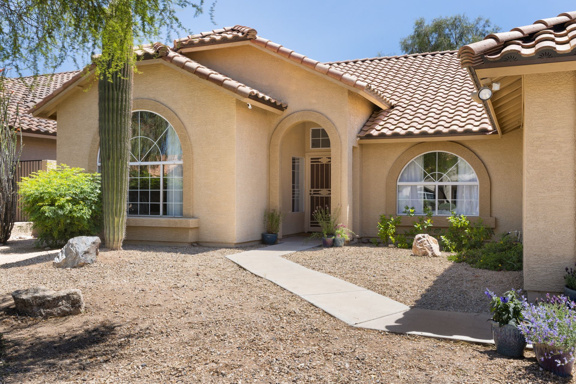 A house with a tiled roof and arched windows