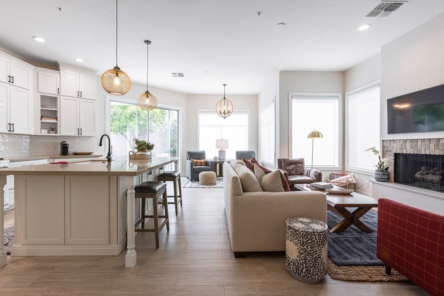 A living room with a couch and a fireplace in a house.