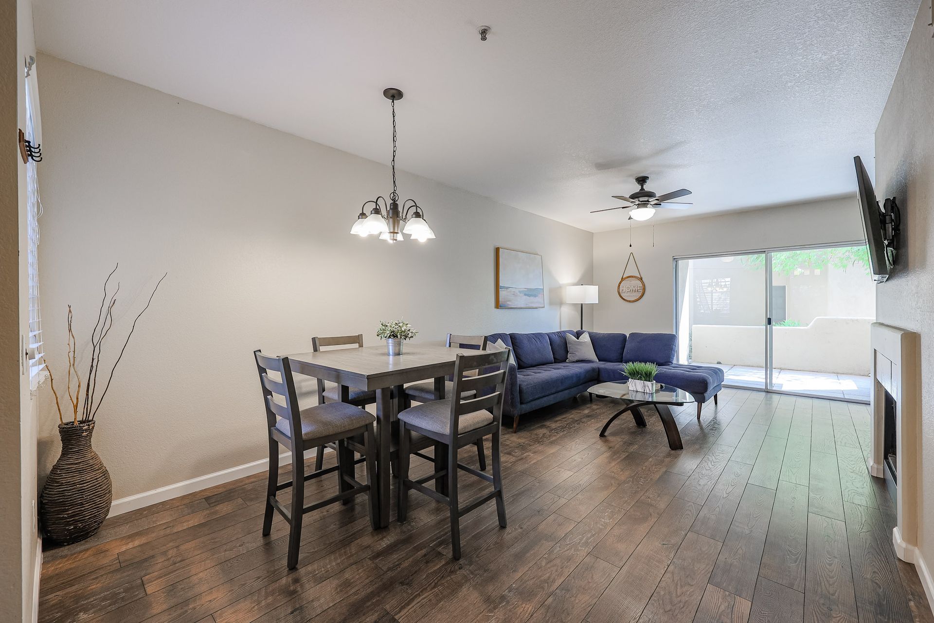 A living room with a table and chairs and a couch