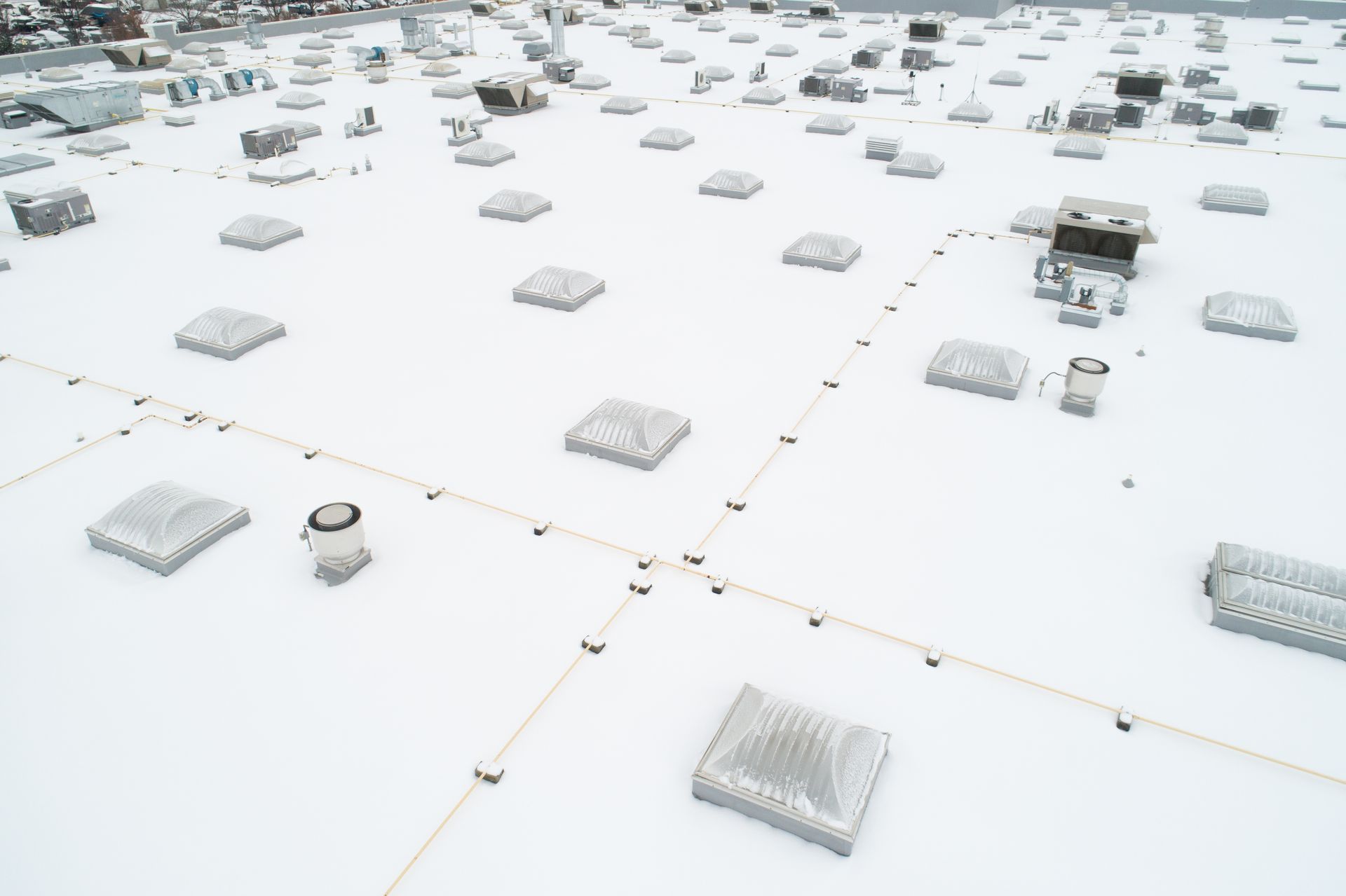 The roof of a building is covered in snow.