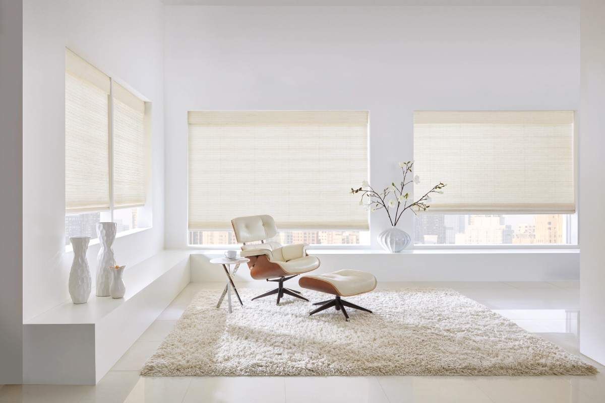 Hunter Douglas Provenance® Woven Woven Wood Shades in a cream-colored room.