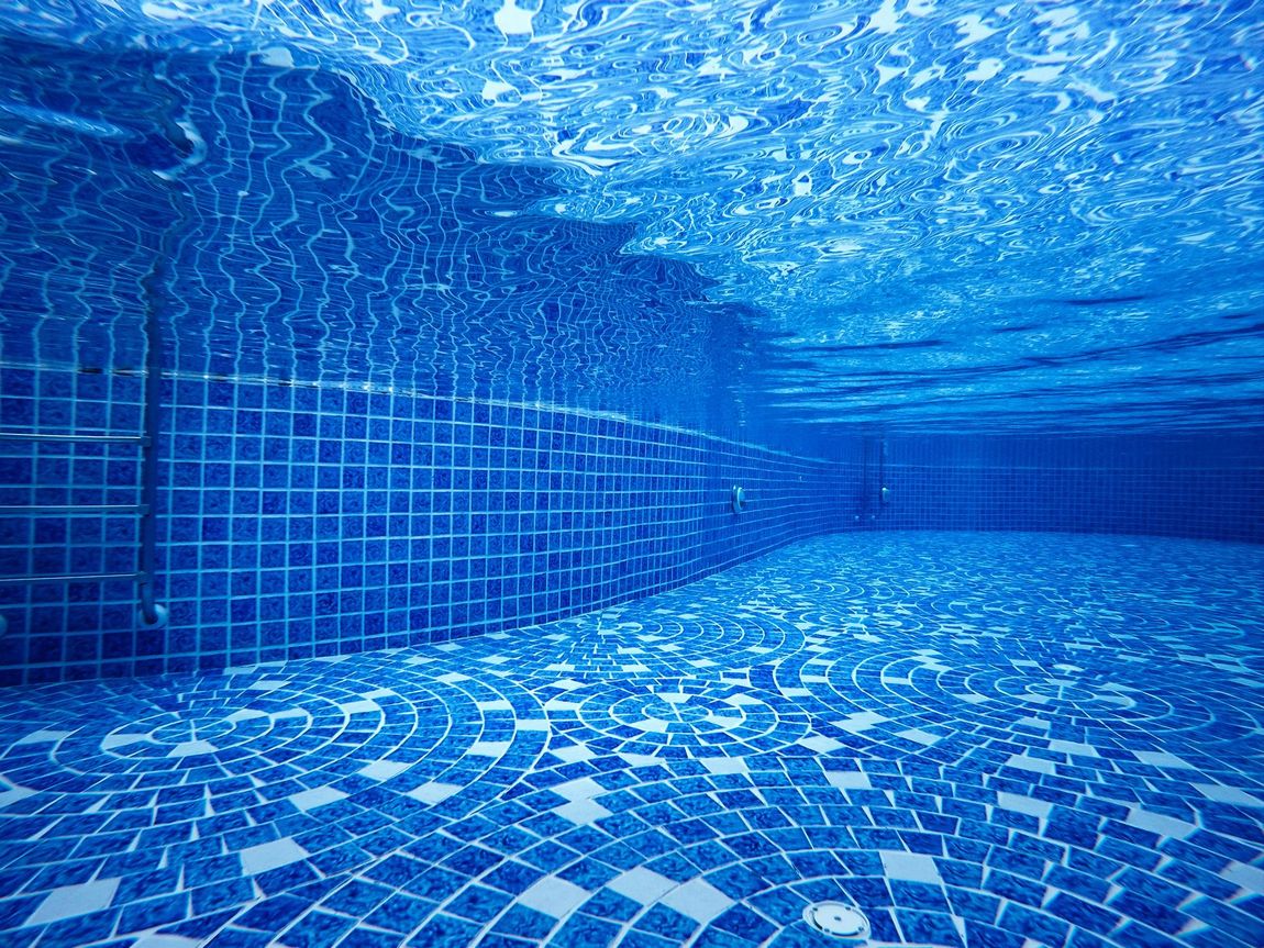 view underwater the pool empty background blue water transparent.