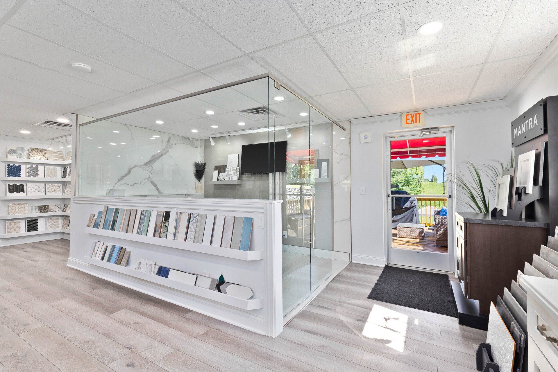 A large room with a glass wall and a counter in the middle.