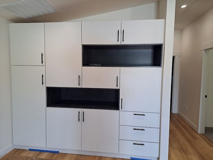 A kitchen with a large island and wooden cabinets.
