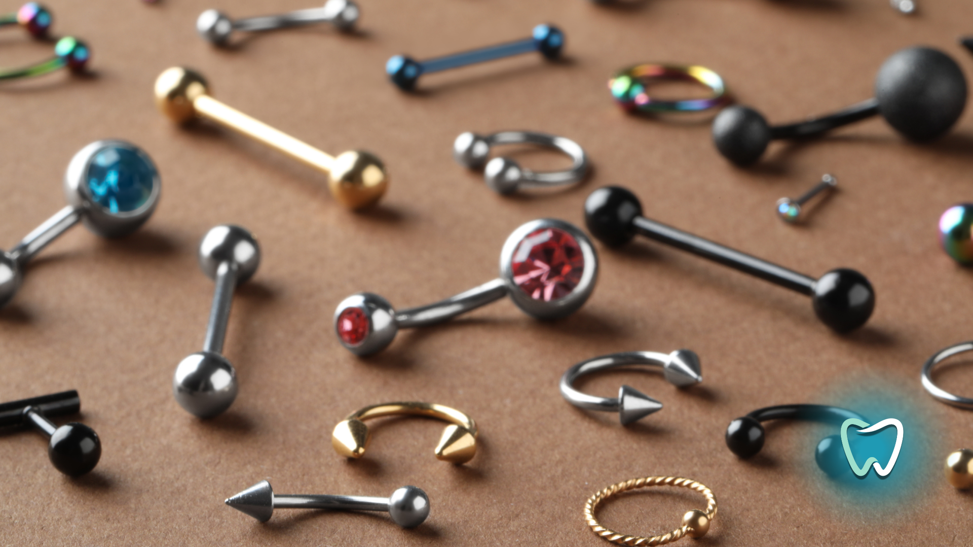 A bunch of different types of piercings on a table