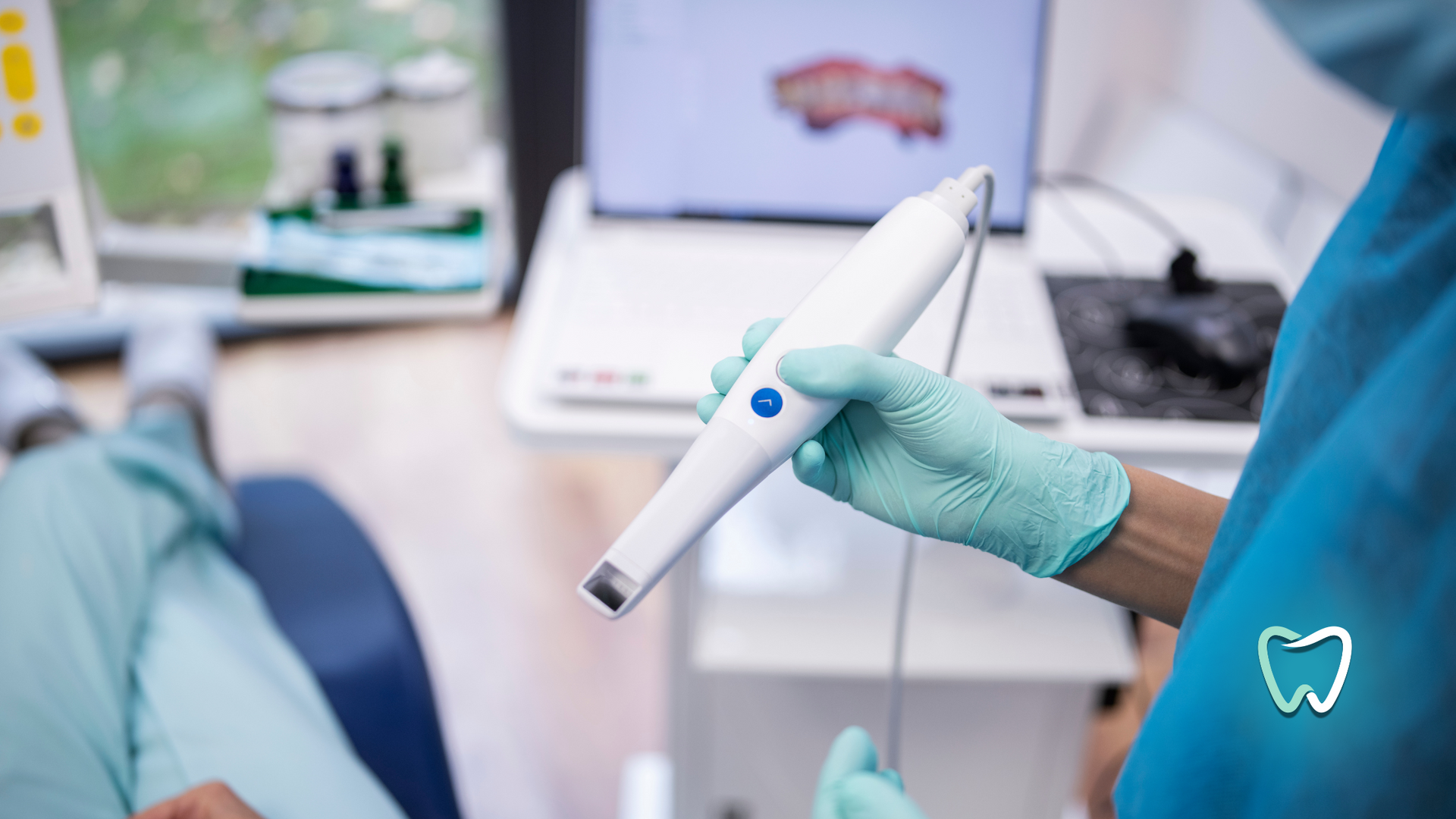 A dentist is holding a 3d scanner in front of a patient.