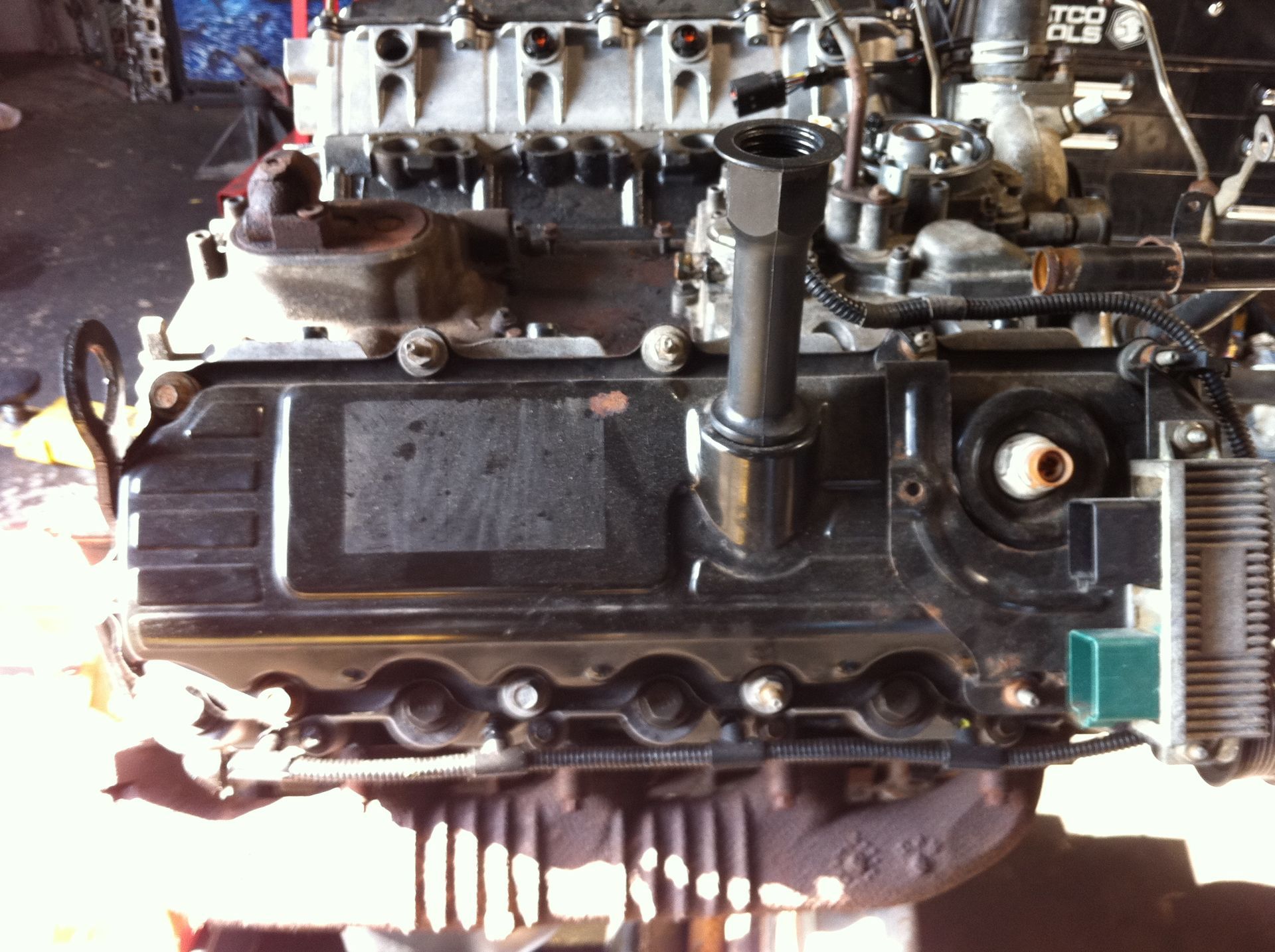 A black engine is sitting on a white table