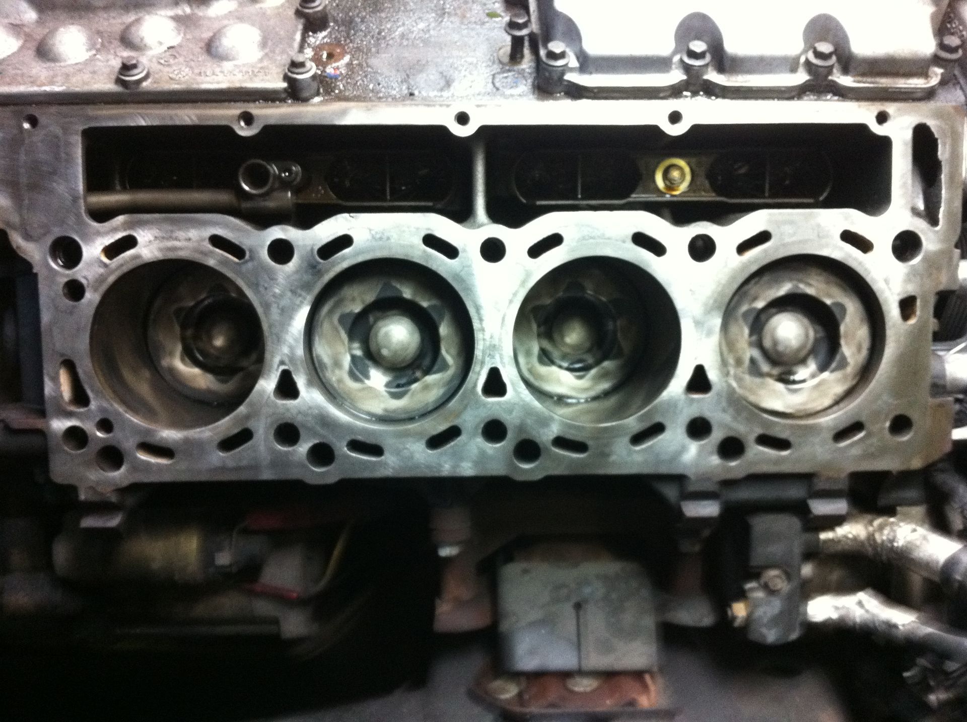 A close up of a cylinder head of a car engine