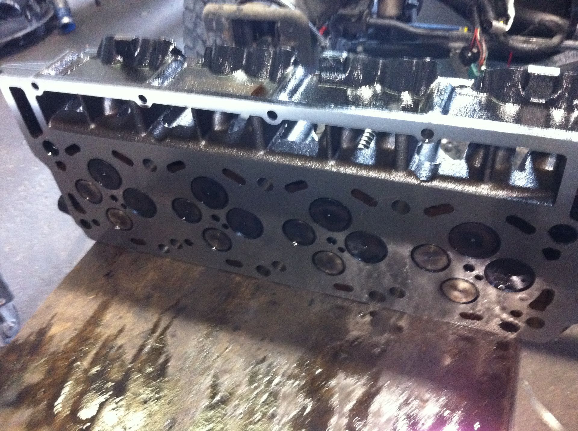 A close up of a cylinder head on a table