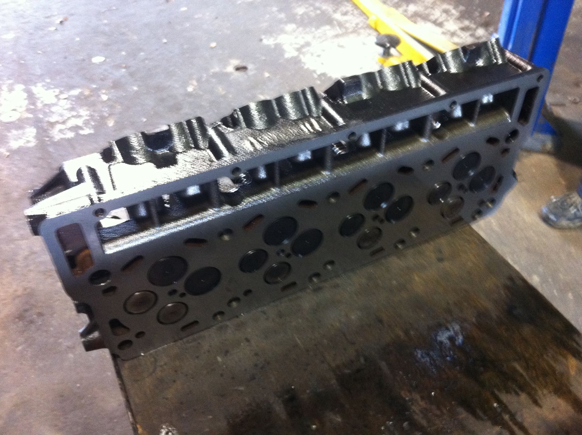 A close up of a cylinder head on a table