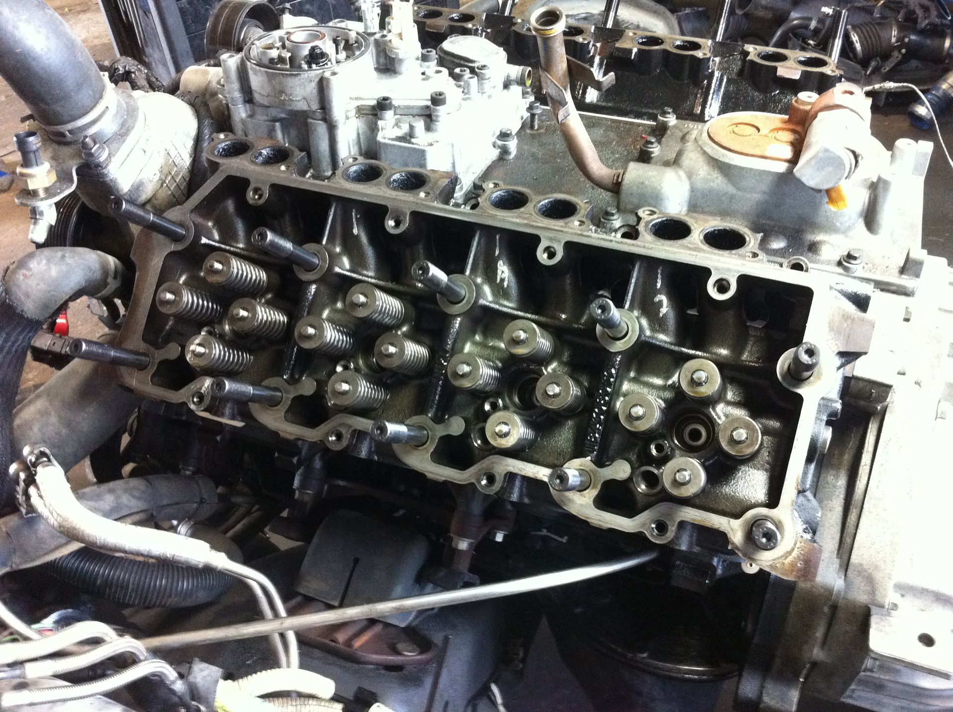 A close up of a car engine being worked on