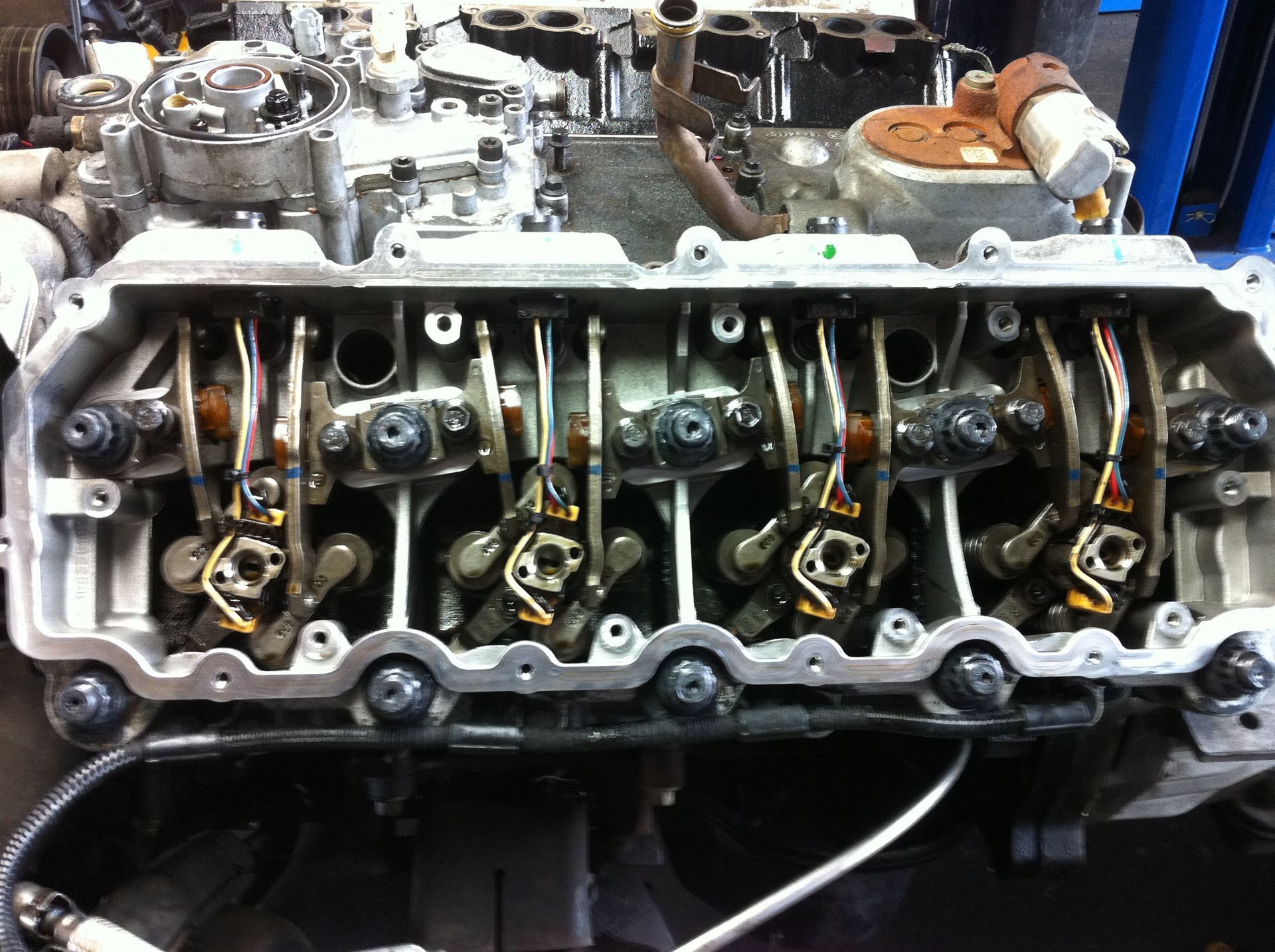 A close up of a cylinder head of a car engine