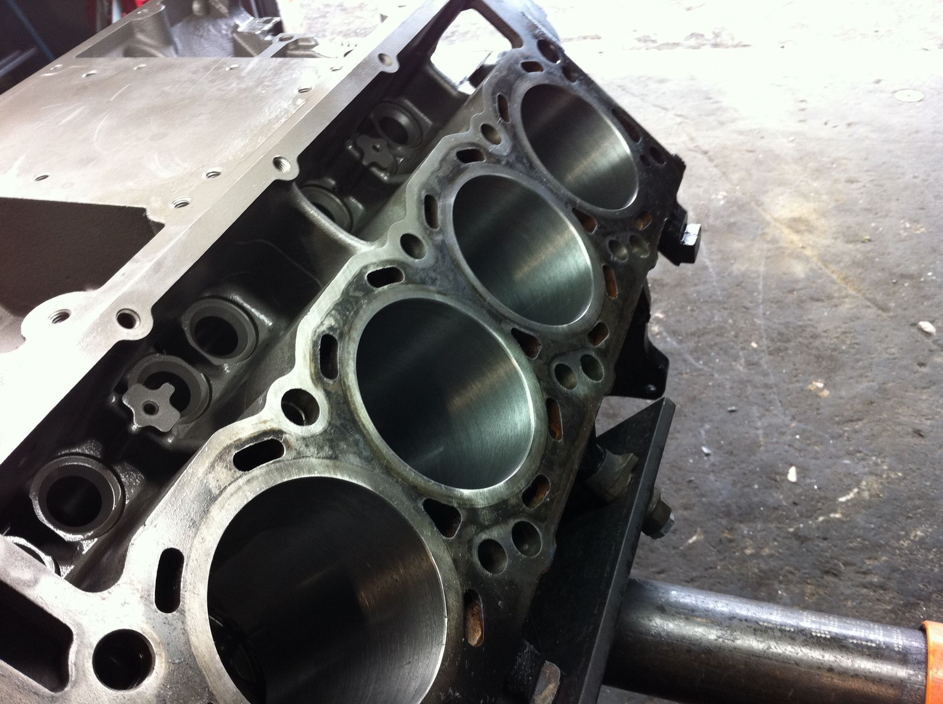 A close up of a cylinder block with holes in it