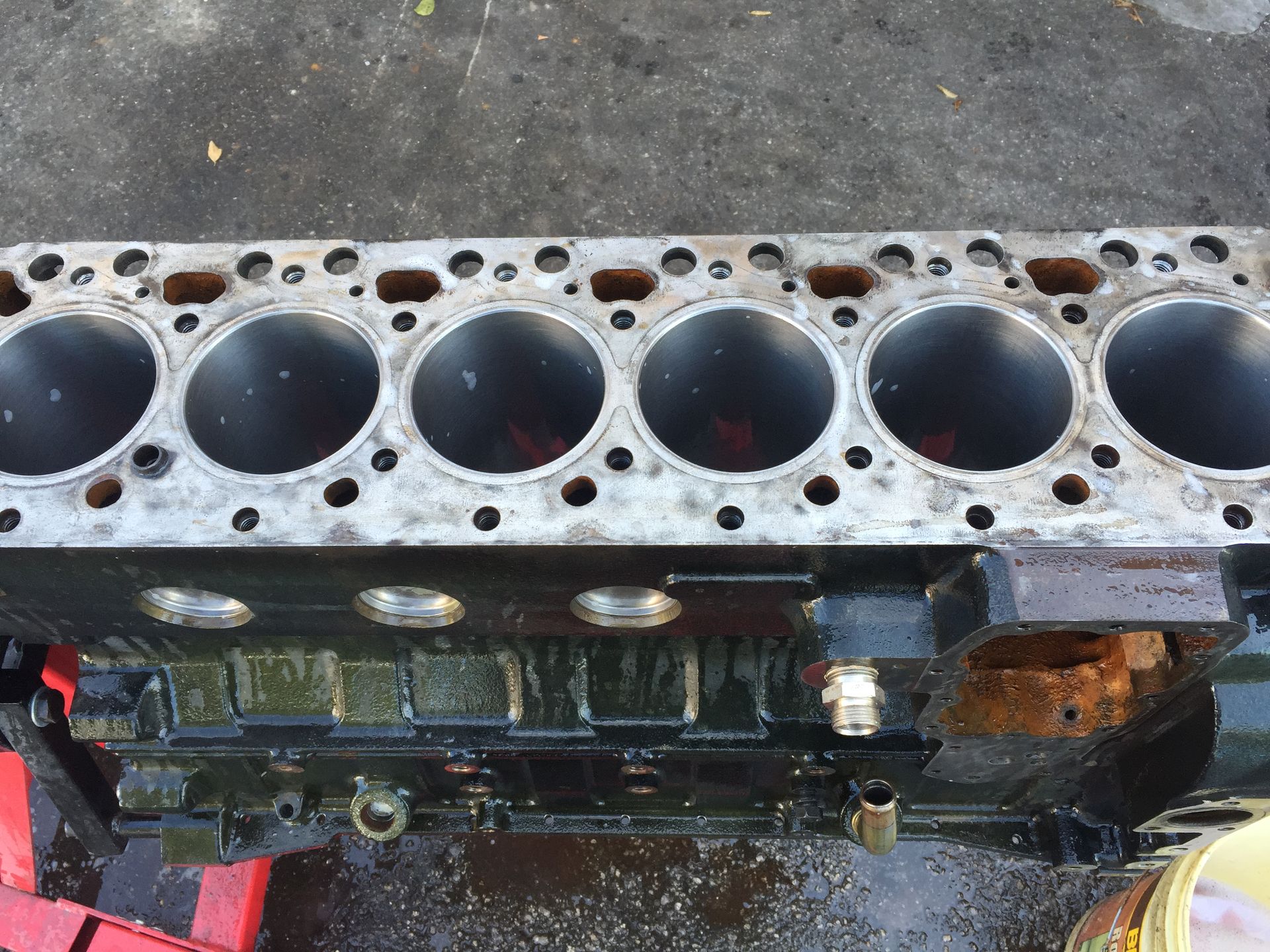 A close up of a cylinder block with holes in it