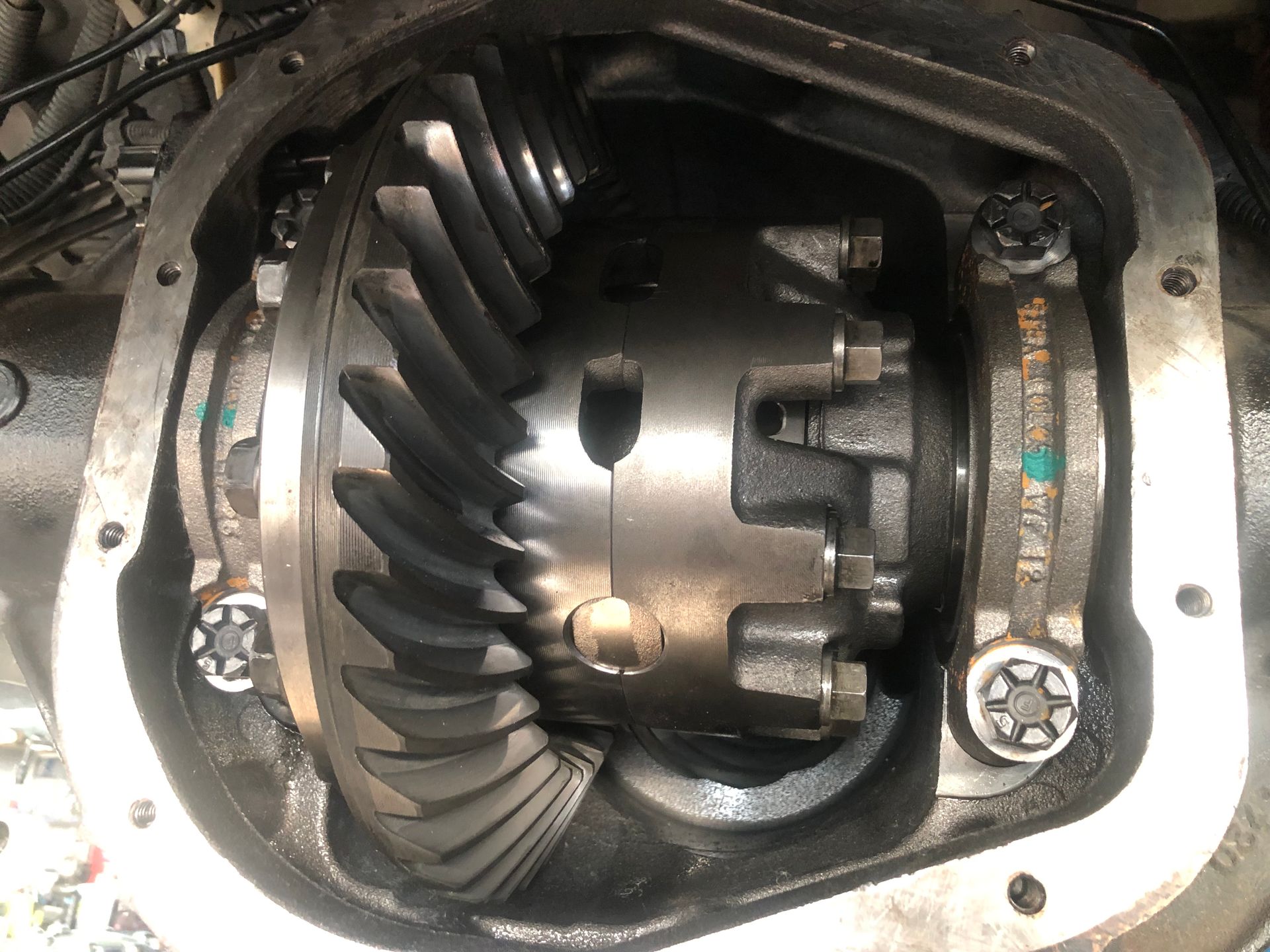 A close up of a rear differential on a car.