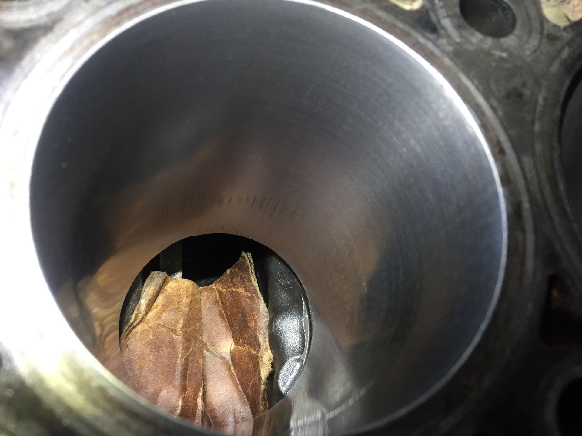 A close up of a metal cylinder with a hole in it