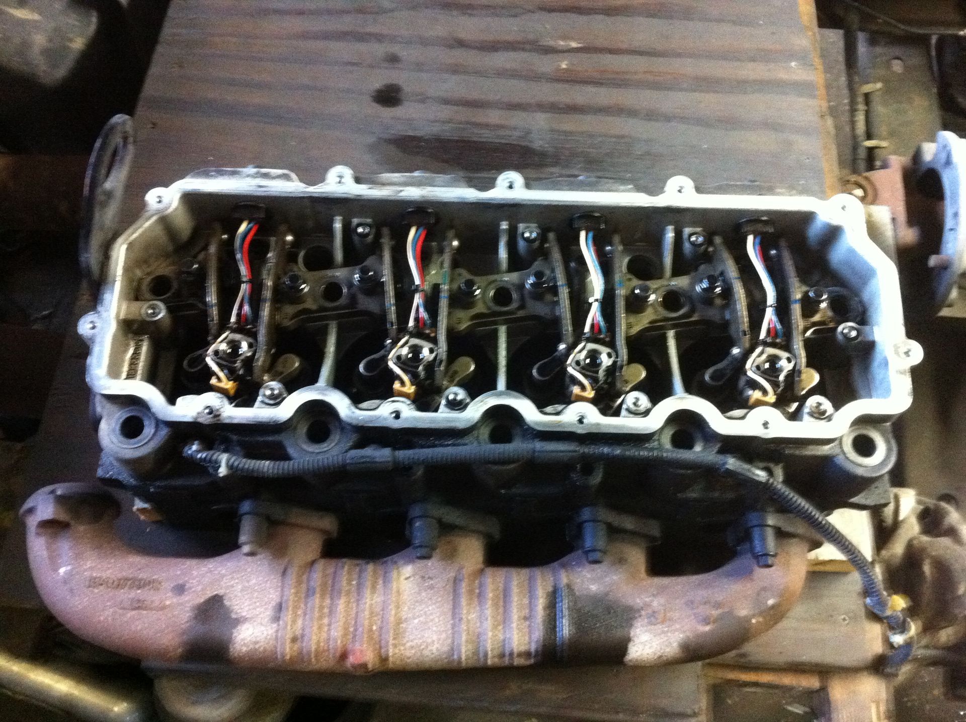 A close up of a cylinder head on a table