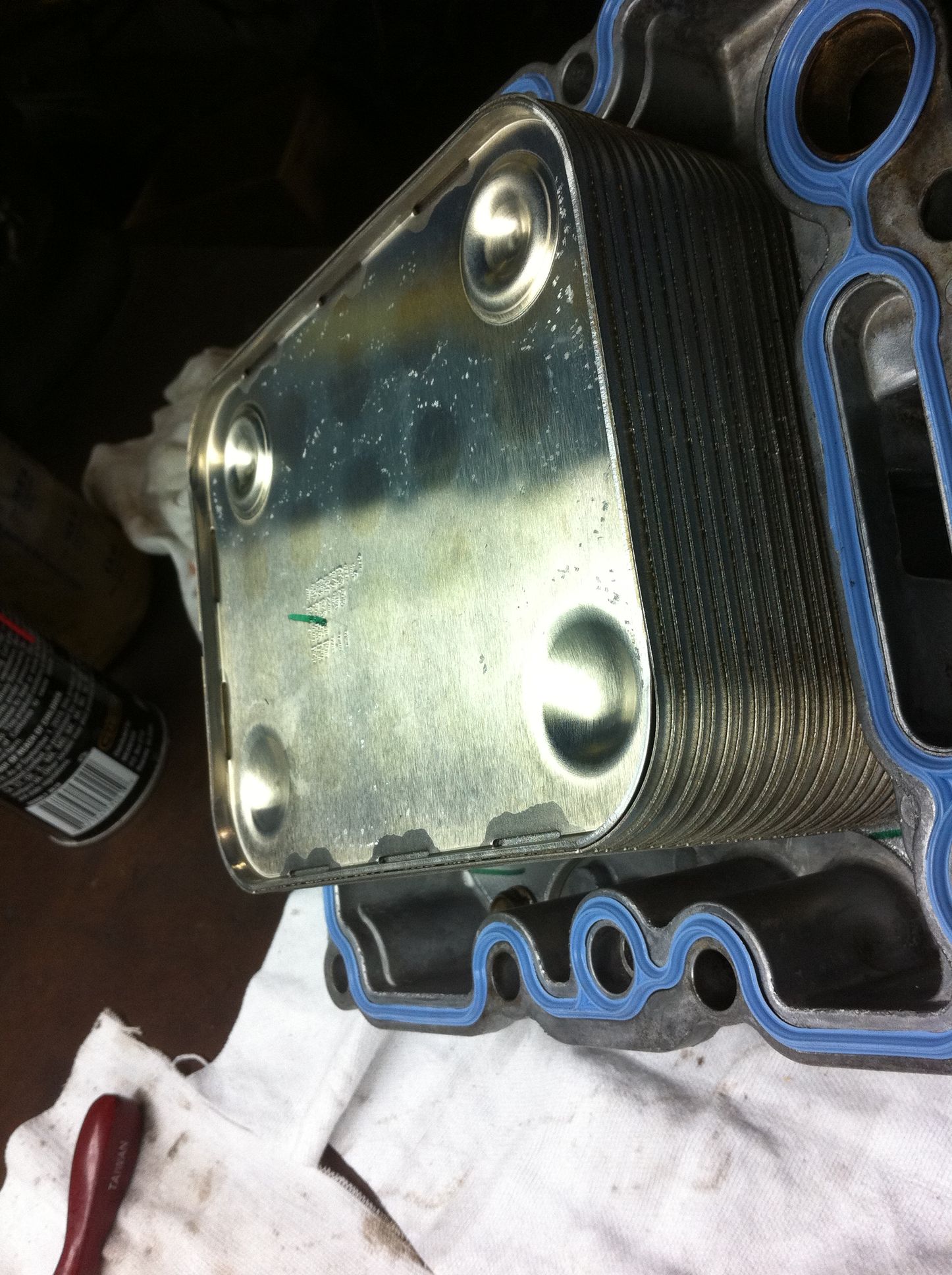 A close up of an oil cooler on a white cloth