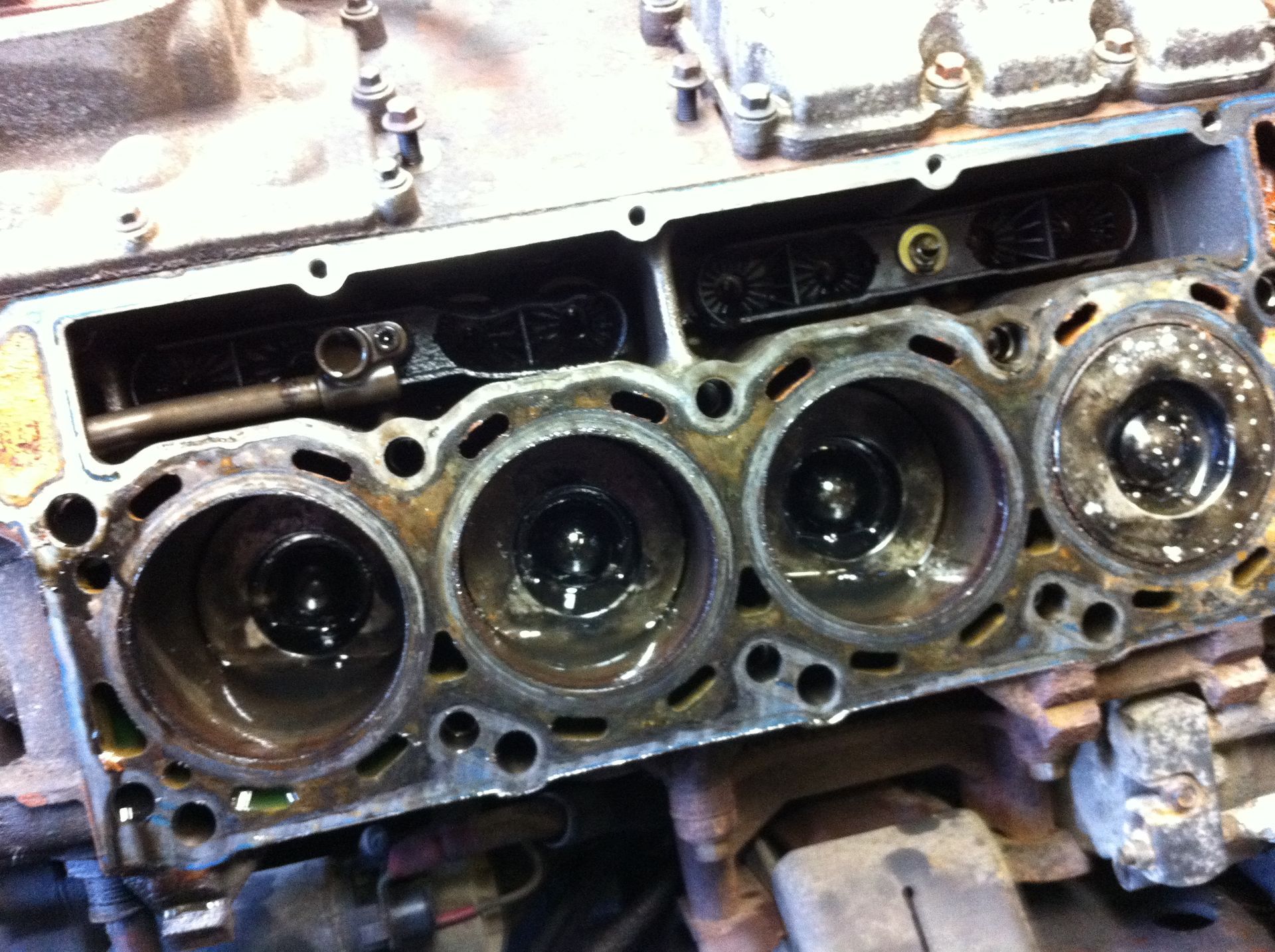 A close up of a cylinder head of a car engine