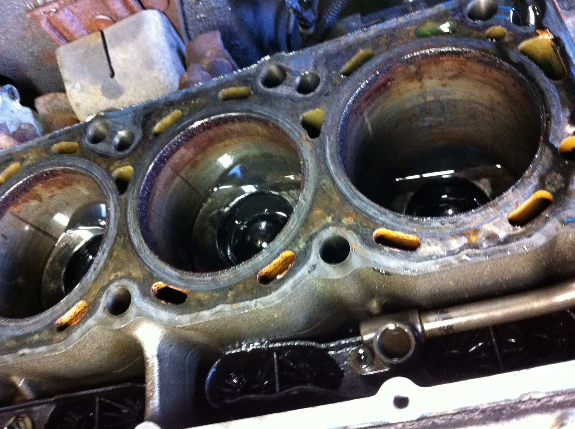 A close up of a cylinder block of a car engine.