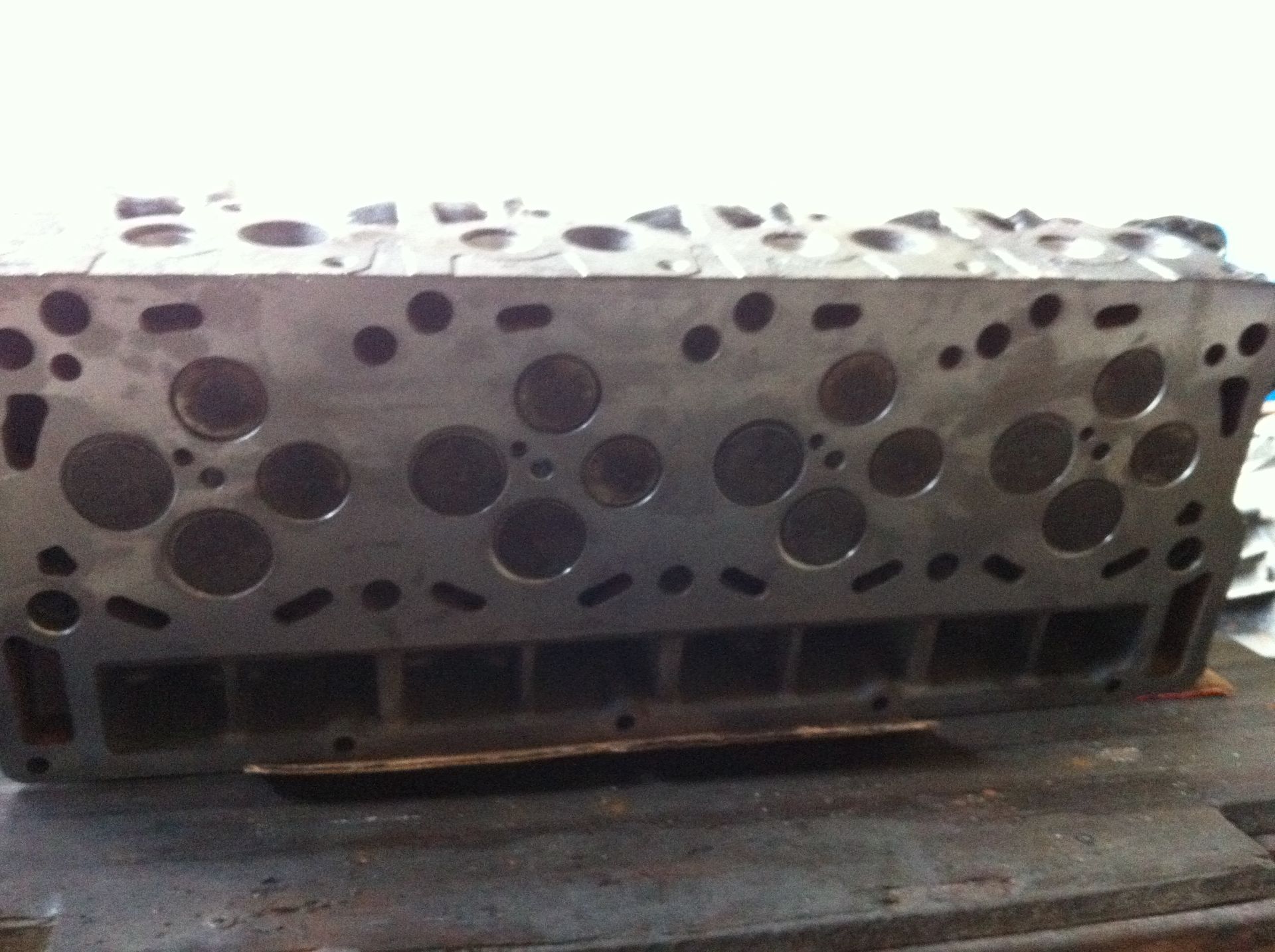 A metal object with holes in it is sitting on a table