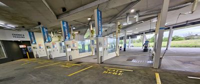 The inside of a car wash with a lot of signs on the walls — Signworld In Mitchell, ACT