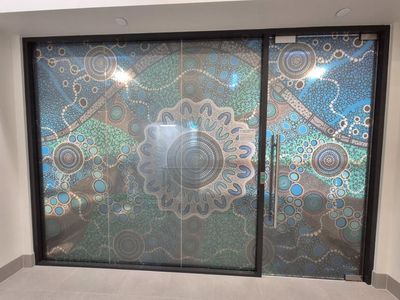 A Door With a Stained Glass Design on It — Signworld In Mitchell, ACT