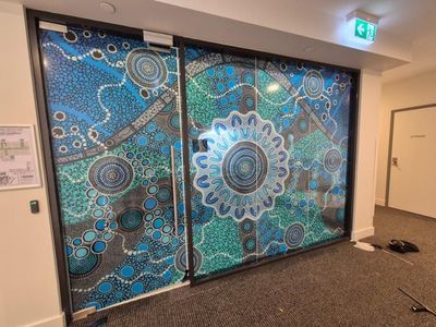 A Door With a Painting on It in a Hallway — Signworld In Mitchell, ACT