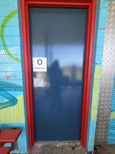 A Blue Door With a Red Frame and a Sign That Says O on It — Signworld In Mitchell, ACT
