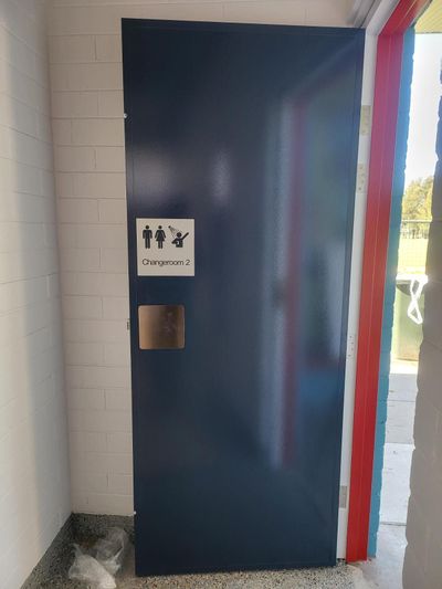 A Blue Door With a Sign on It That Says Toilets — Signworld In Mitchell, ACT