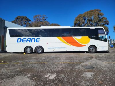 A Deane Bus is Parked in a Parking Lot — Signworld In Mitchell, ACT