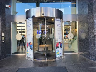 A Revolving Door With a Sign on It That Says Nivea — Signworld In Mitchell, ACT