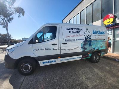A Carpet Steam Cleaning Van is Parked in Front of a Building — Signworld In Mitchell, ACT