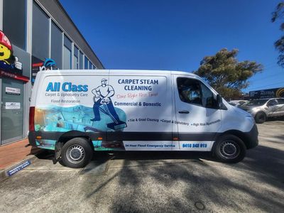 A Carpet Steam Cleaning Van is Parked in Front of a Building — Signworld In Mitchell, ACT