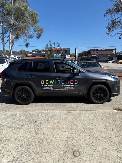 A gray suv is parked in a parking lot — Signworld In Mitchell, ACT