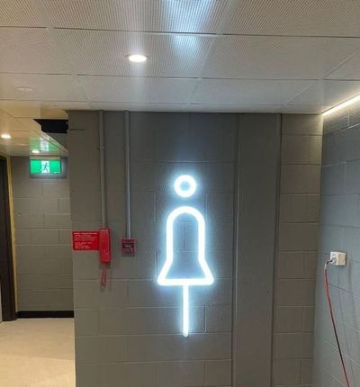 A Hallway With a Sign on the Wall That Says 'Female Toilet' — Signworld In Mitchell, ACT