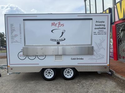 A White Food Truck is Parked in a Parking Lot — Signworld In Mitchell, ACT