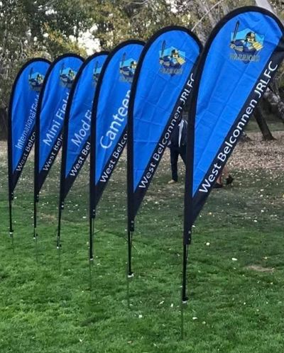 Two Flags in a Field That Say Florey on Them — Signworld In Mitchell, ACT
