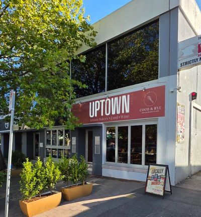 A building with a sign that says uptown on it — Signworld In Mitchell, ACT